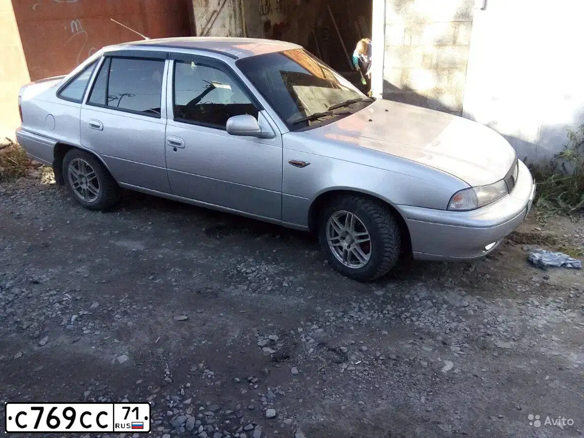 Фото автомобиля DAEWOO NEXIA, 2006 — госномер С769СС71. Цвет: серебристый