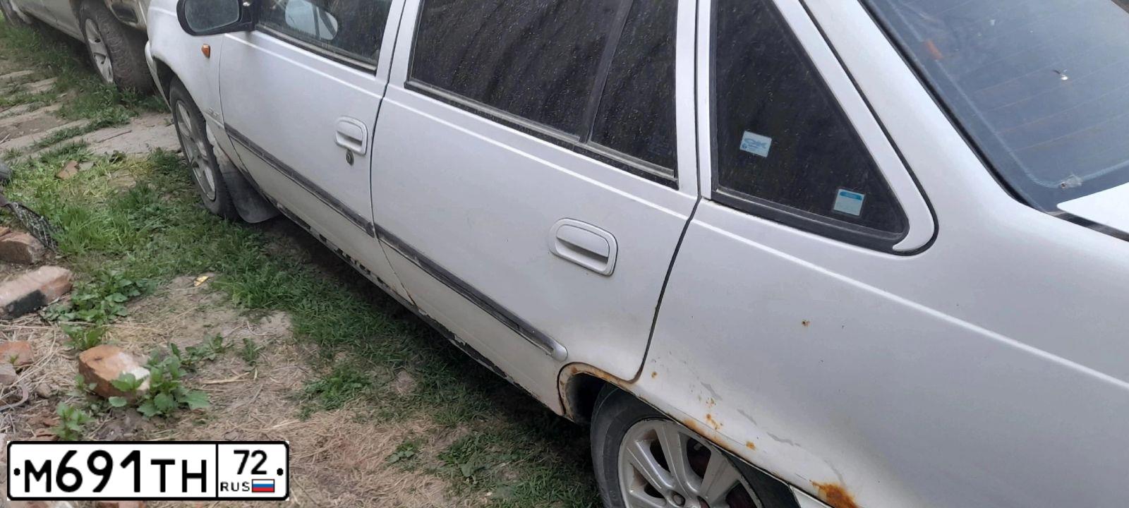 Фото автомобиля DAEWOO NEXIA, 1997 — госномер М691ТН72. Цвет: Белый