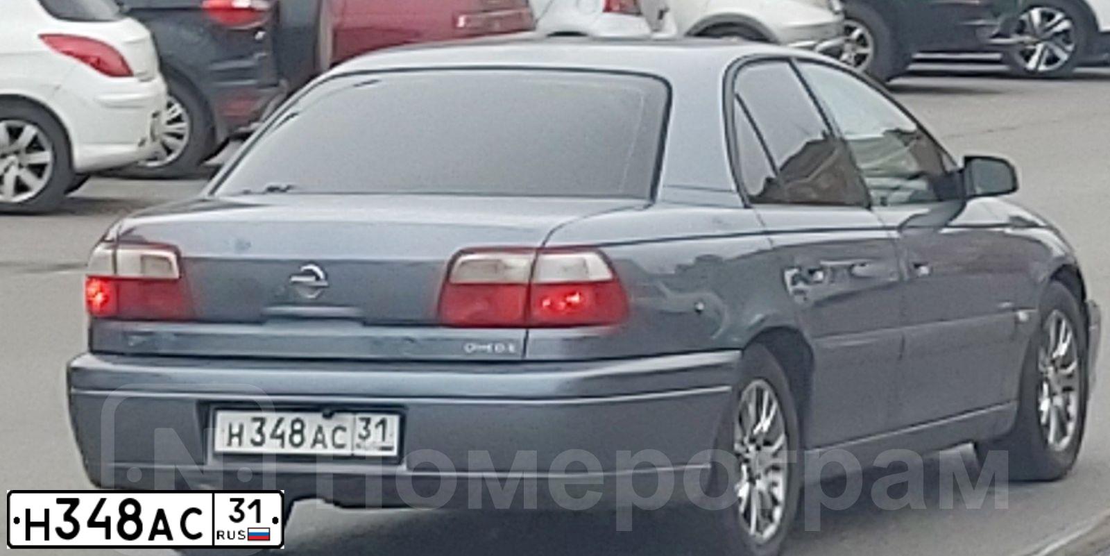 Фото автомобиля OPEL OMEGA, 2003 — госномер Н348АС31. Цвет: Серый