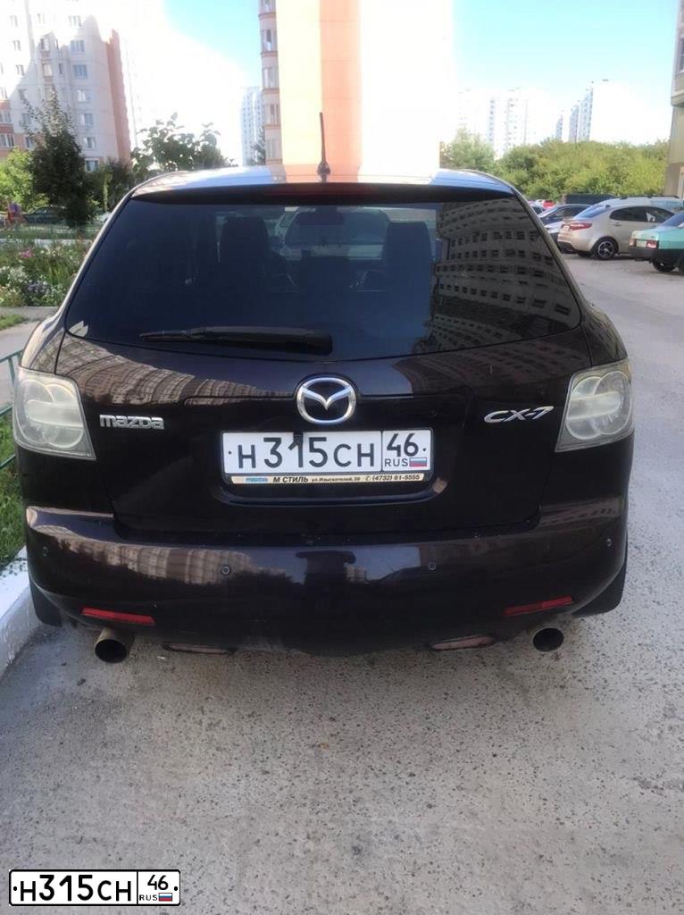 Фото автомобиля MAZDA CX-7, 2007 — госномер Н009ВО46. Цвет: ТЕМНО-ВИШНЕВЫЙ