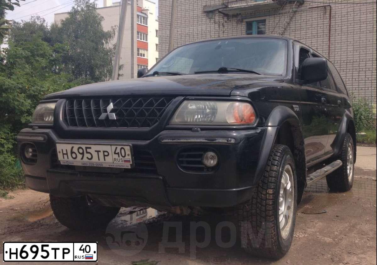 Фото автомобиля MITSUBISHI MONTERO, 2000 — госномер Е044ВО40. Цвет: ЧЕРНЫЙ