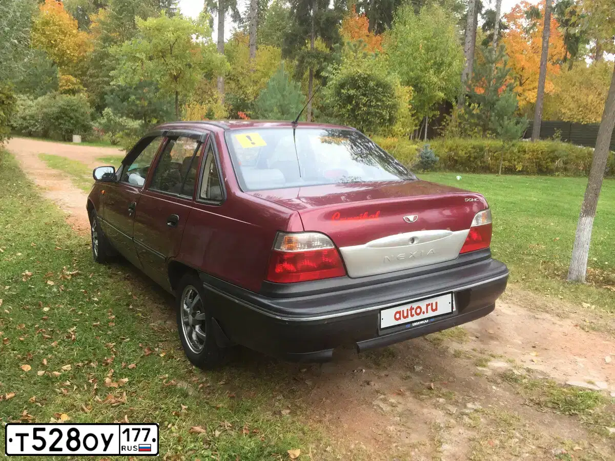 Фото автомобиля DAEWOO NEXIA, 2006 — госномер Т528ОУ177. Цвет: КРАСНЫЙ (СПЕЛАЯ ВИШНЯ)