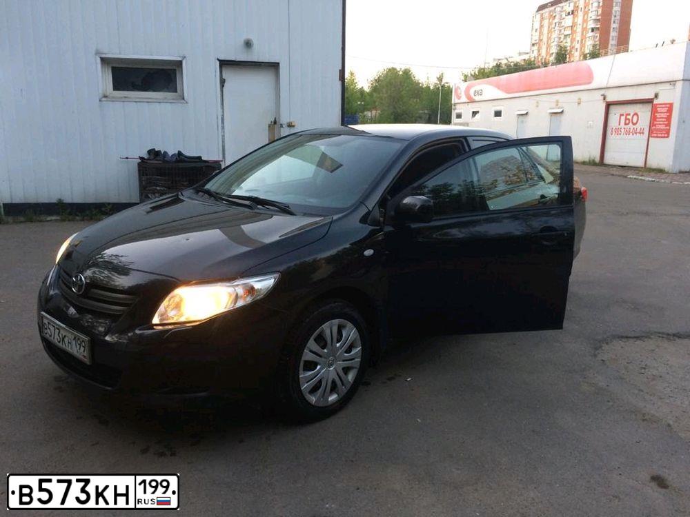 Фото автомобиля TOYOTA COROLLA, 2008 — госномер В573КН199. Цвет: ЧЕРНЫЙ