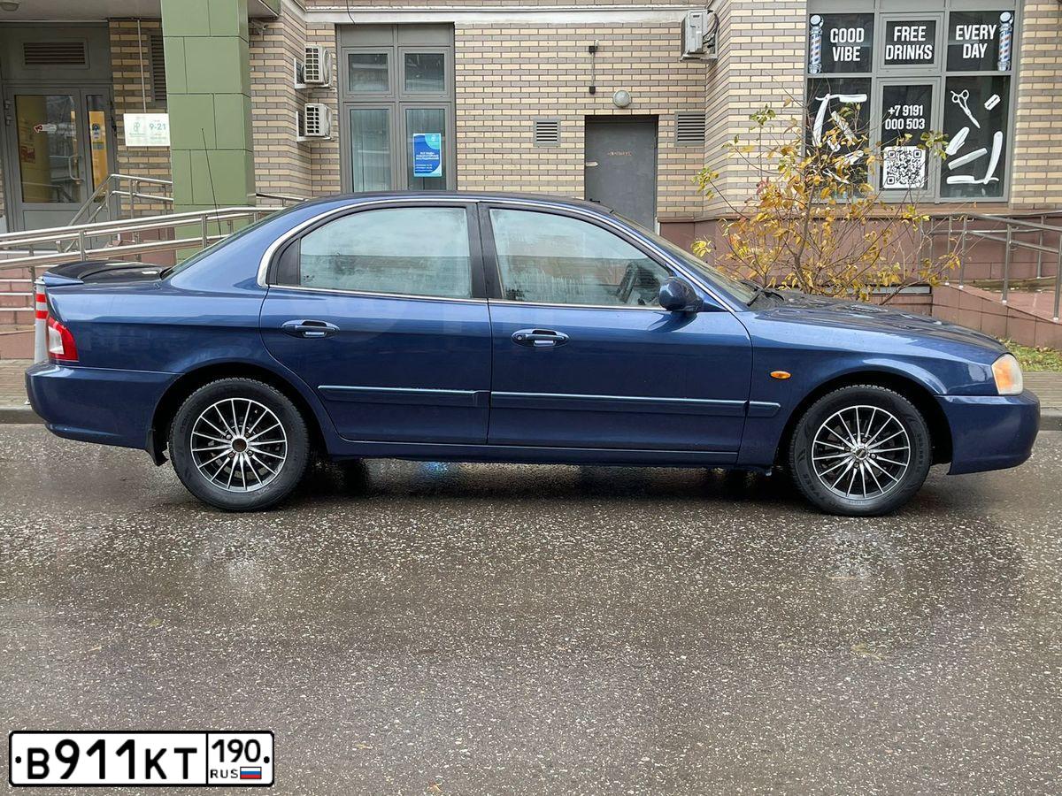Фото автомобиля KIA MAGENTIS / OPTIMA, 2004 — госномер В911КТ190. Цвет: синий
