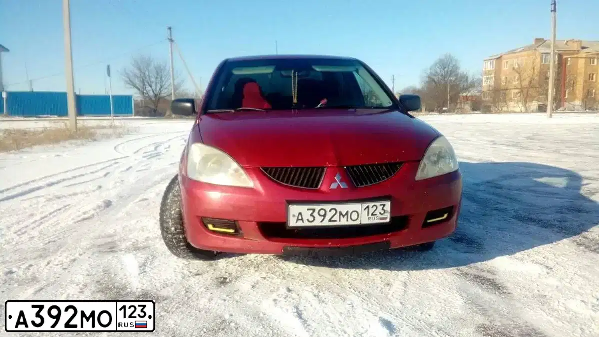 Фото автомобиля MITSUBISHI LANCER, 2003 — госномер М764МЕ126. Цвет: Красный