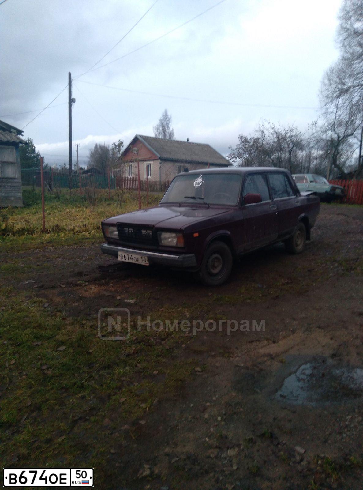 Фото автомобиля MITSUBISHI LANCER, 1993 — госномер У762РН750. Цвет: синий