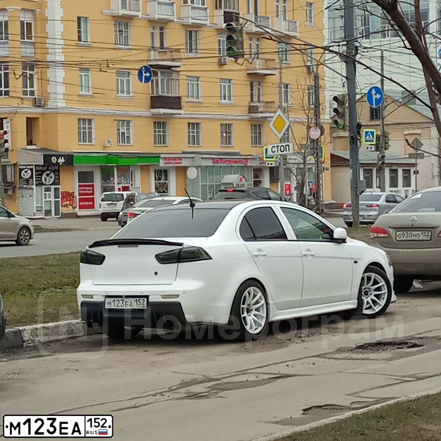 Фото автомобиля MITSUBISHI LANCER, 2008 — госномер М123ЕА152. Цвет: БЕЛЫЙ