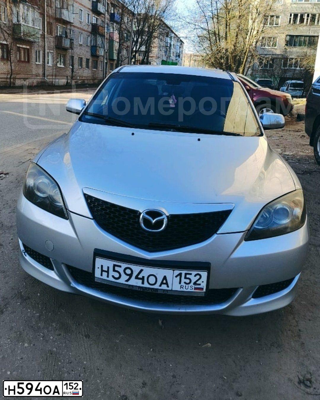 Фото автомобиля MAZDA A 3, 2005 — госномер Т626ОТ199. Цвет: СВЕТЛО-СЕРЫЙ
