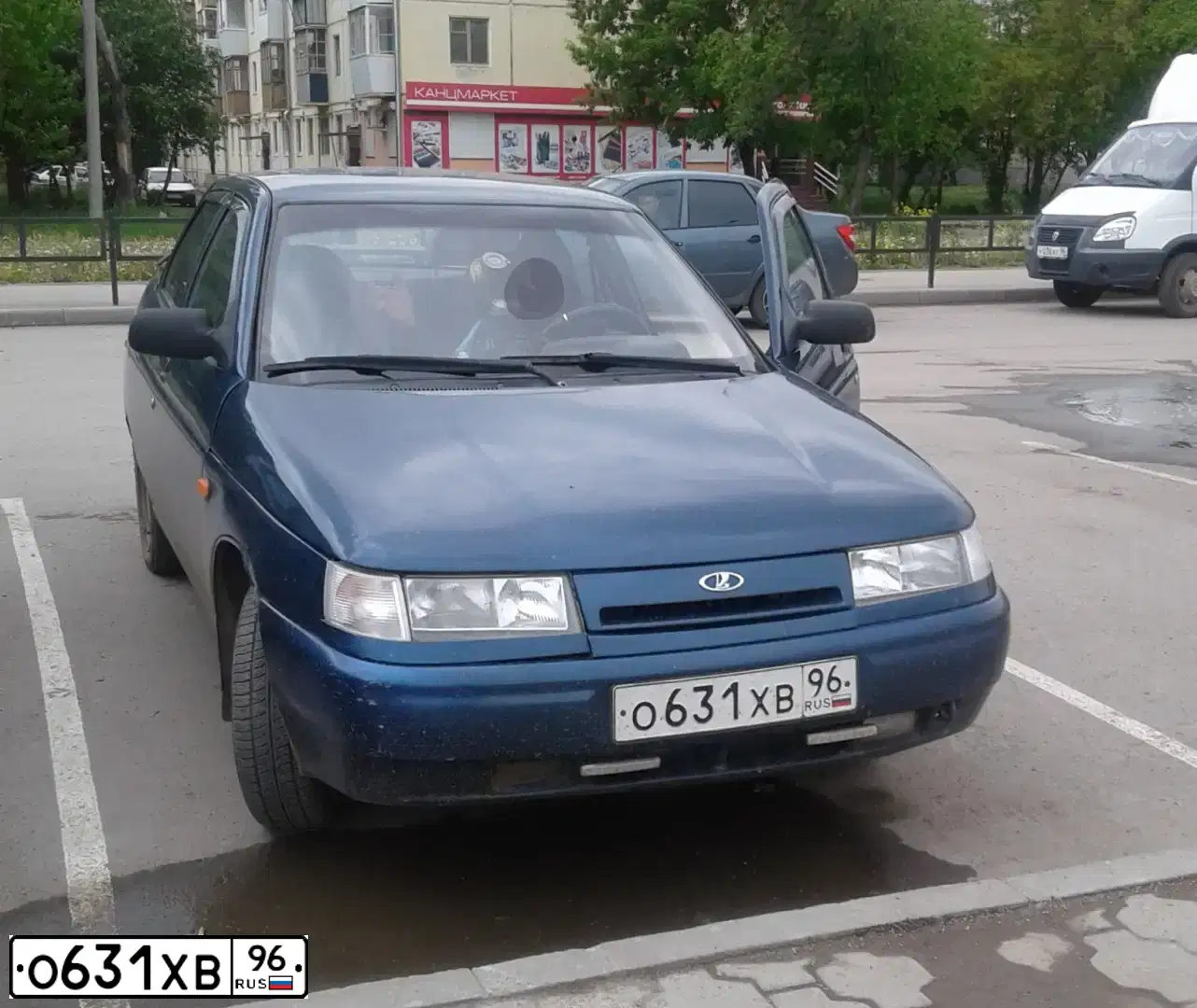 Фото автомобиля LADA 2110, 2005 — госномер М064РХ196. Цвет: ТЕМНО-СИНИЙ