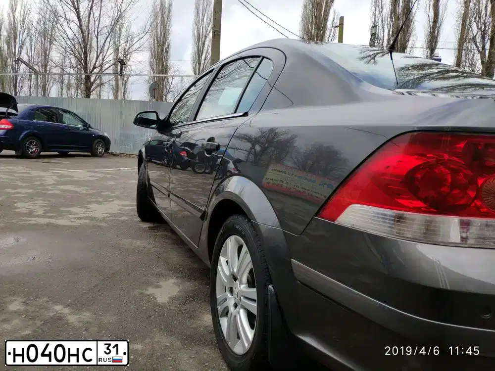 Фото автомобиля OPEL ASTRA, 2012 — госномер Т102МС761. Цвет: ТЕМНО-СЕРЫЙ