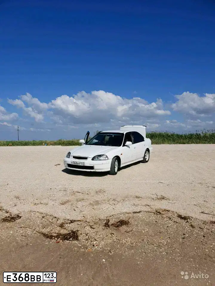 Фото автомобиля MITSUBISHI LANCER, 2008 — госномер Е368ВВ123. Цвет: ЧЕРНЫЙ