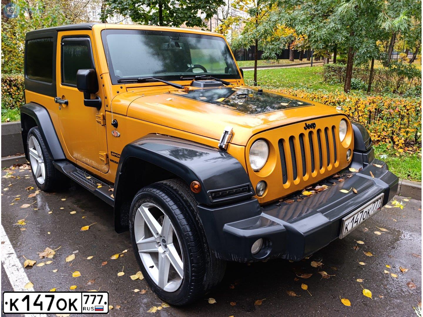 Фото автомобиля JEEP WRANGLER, 2013 — госномер К147ОК777. Цвет: ОРАНЖЕВЫЙ