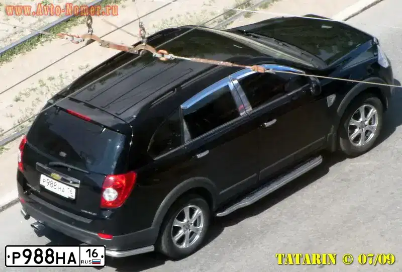 Фото автомобиля CHEVROLET CAPTIVA, 2006 — госномер Е947КВ11. Цвет: ЧЕРНЫЙ
