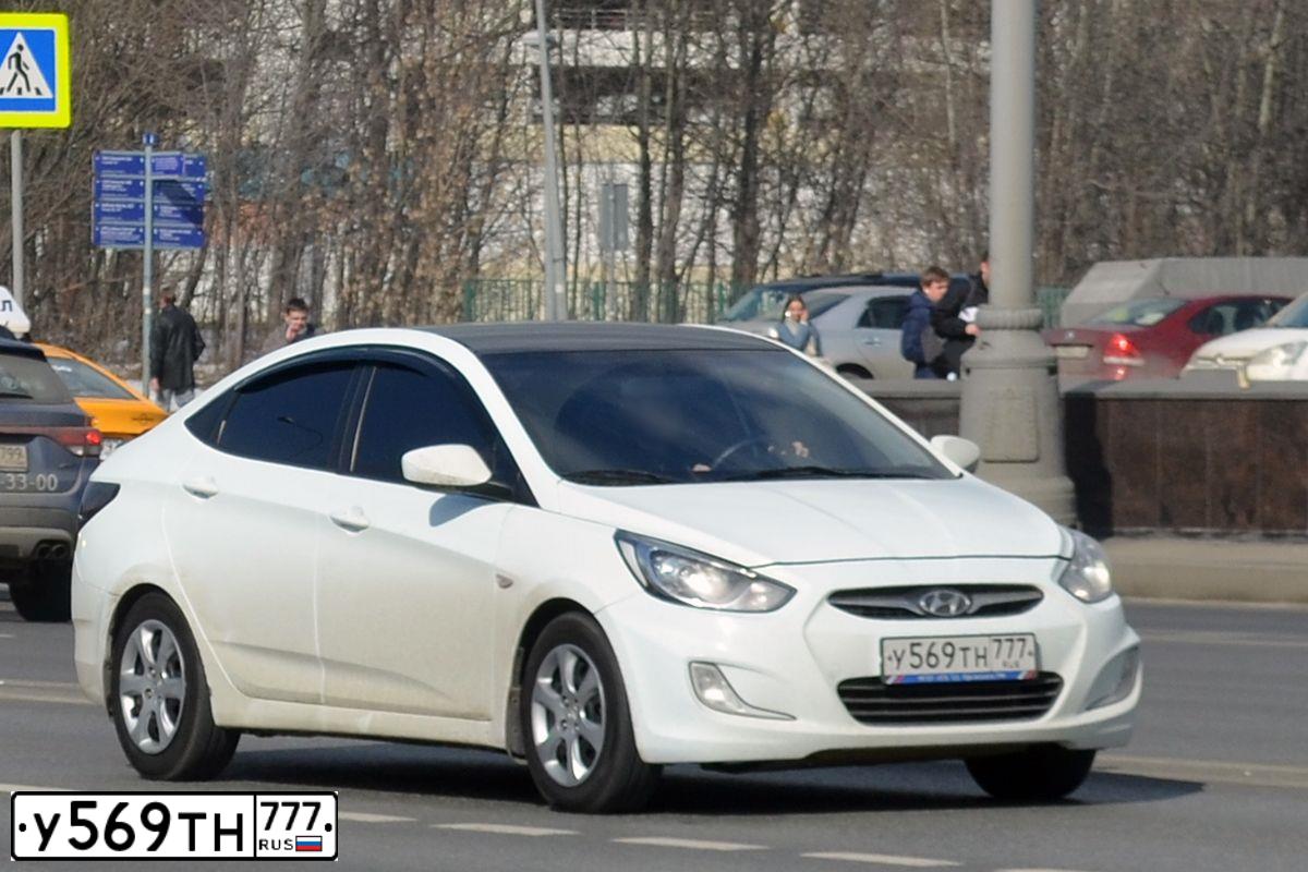 Фото автомобиля HYUNDAI SOLARIS, 2011 — госномер У569ТН777. Цвет: Белый черный 