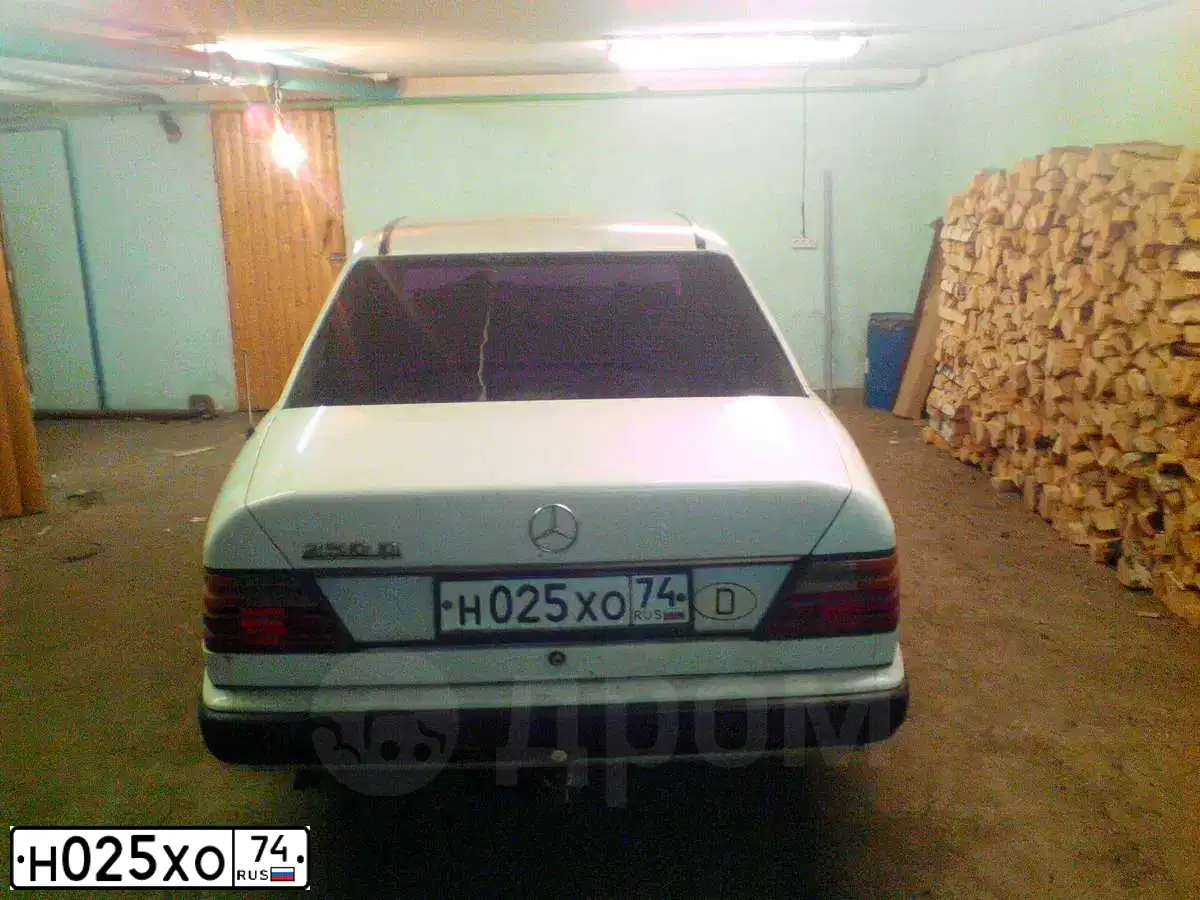 Фото автомобиля MERCEDES E-KLASSE, 1986 — госномер Н025ХО74. Цвет: Белый