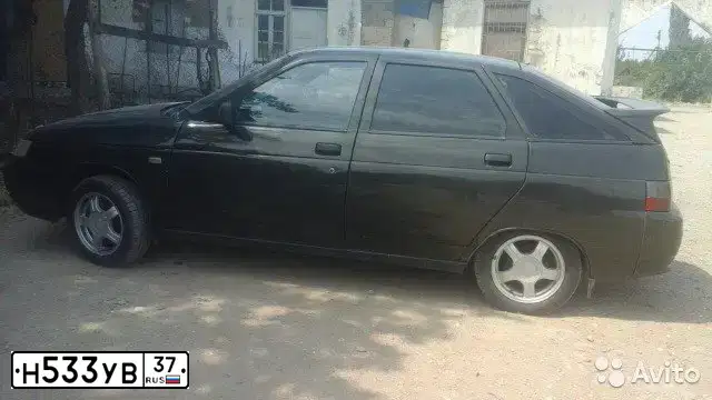 Фото автомобиля LADA 2112 LADA, 2006 — госномер Н533УВ37. Цвет: Темно-зеленый