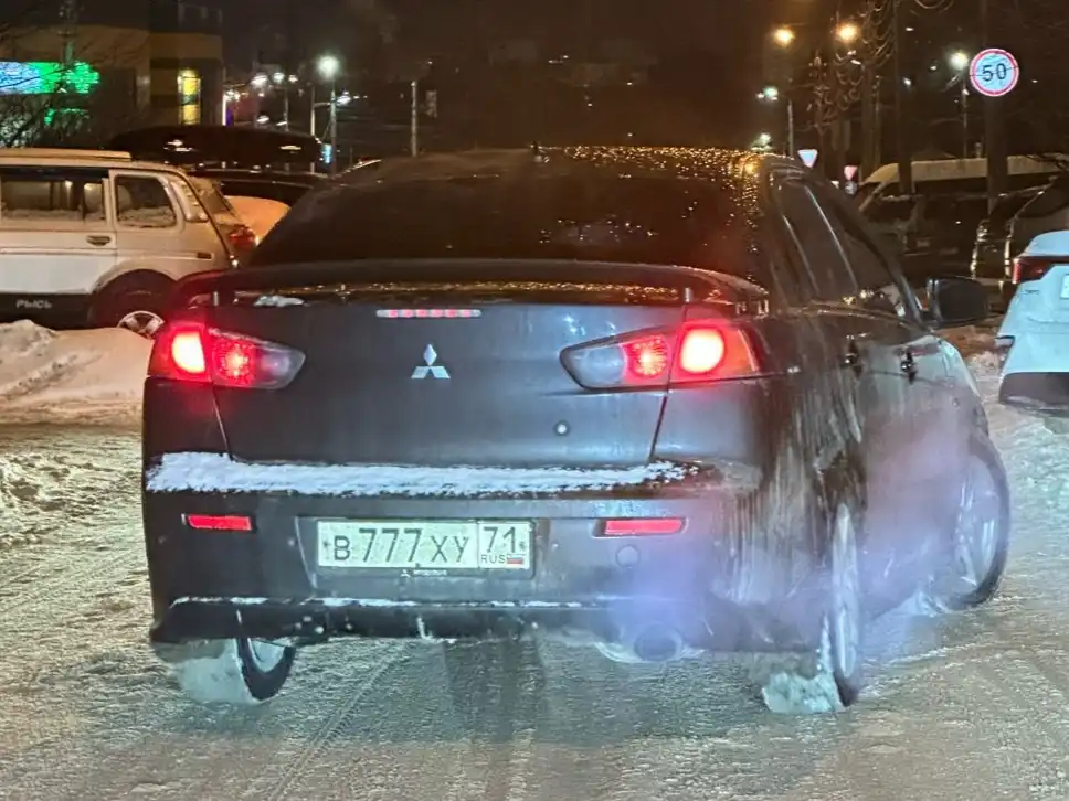 Фото автомобиля MITSUBISHI LANCER, 2012 — госномер В777ХУ71. Цвет: ЧЕРНЫЙ
