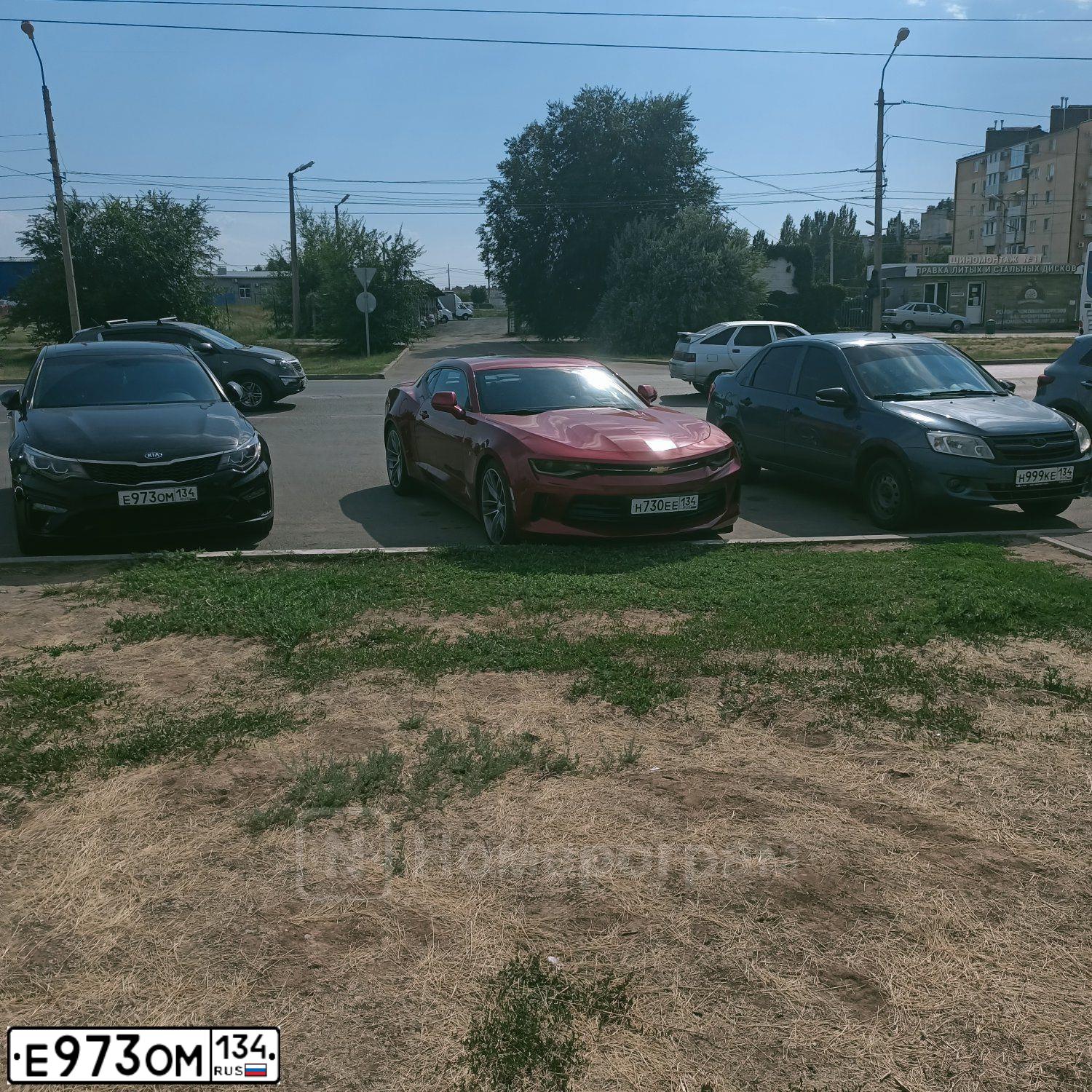 Фото автомобиля KIA MAGENTIS / OPTIMA, 2018 — госномер Е973ОМ134. Цвет: ЧЕРНЫЙ