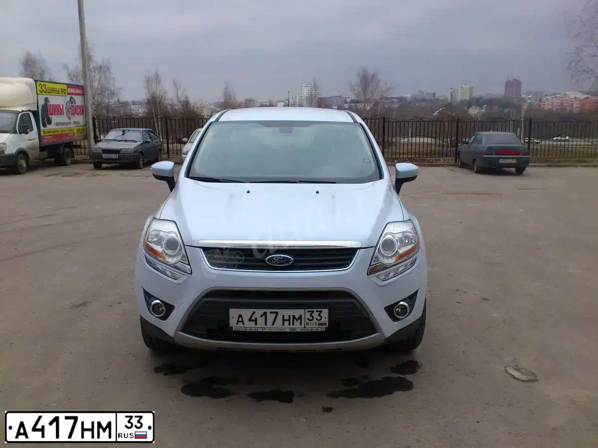 Фото автомобиля FORD KUGA, 2012 — госномер Е082ВР977. Цвет: СВЕТЛО-СЕРЕБРИСТЫЙ