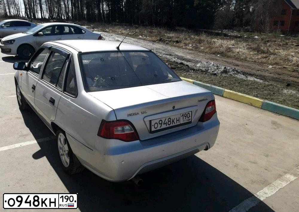 Фото автомобиля DAEWOO NEXIA, 2010 — госномер О948КН190. Цвет: СЕРЫЙ