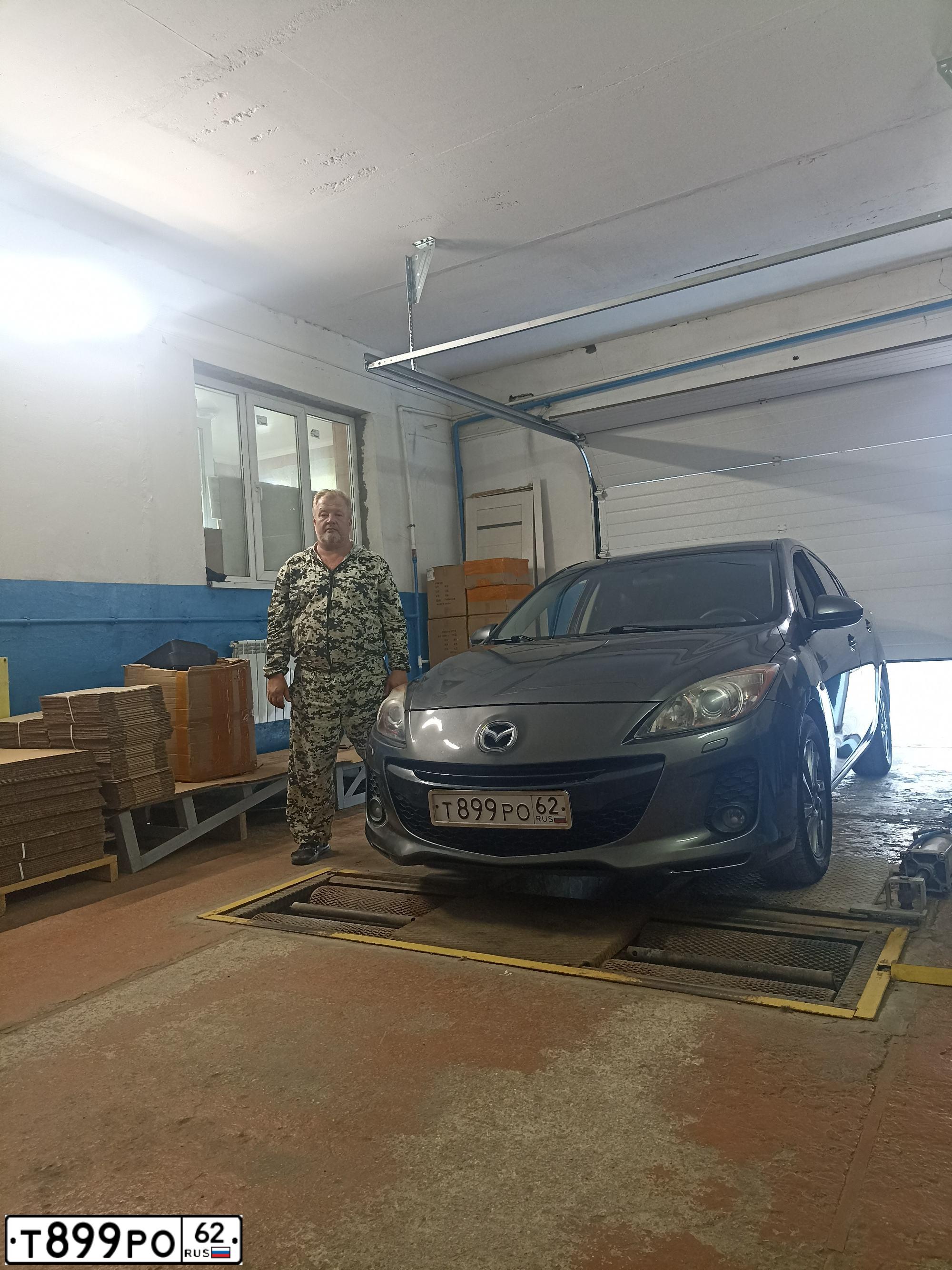 Фото автомобиля MAZDA 3, 2012 — госномер В469УЕ62. Цвет: ТЕМНО-СЕРЫЙ