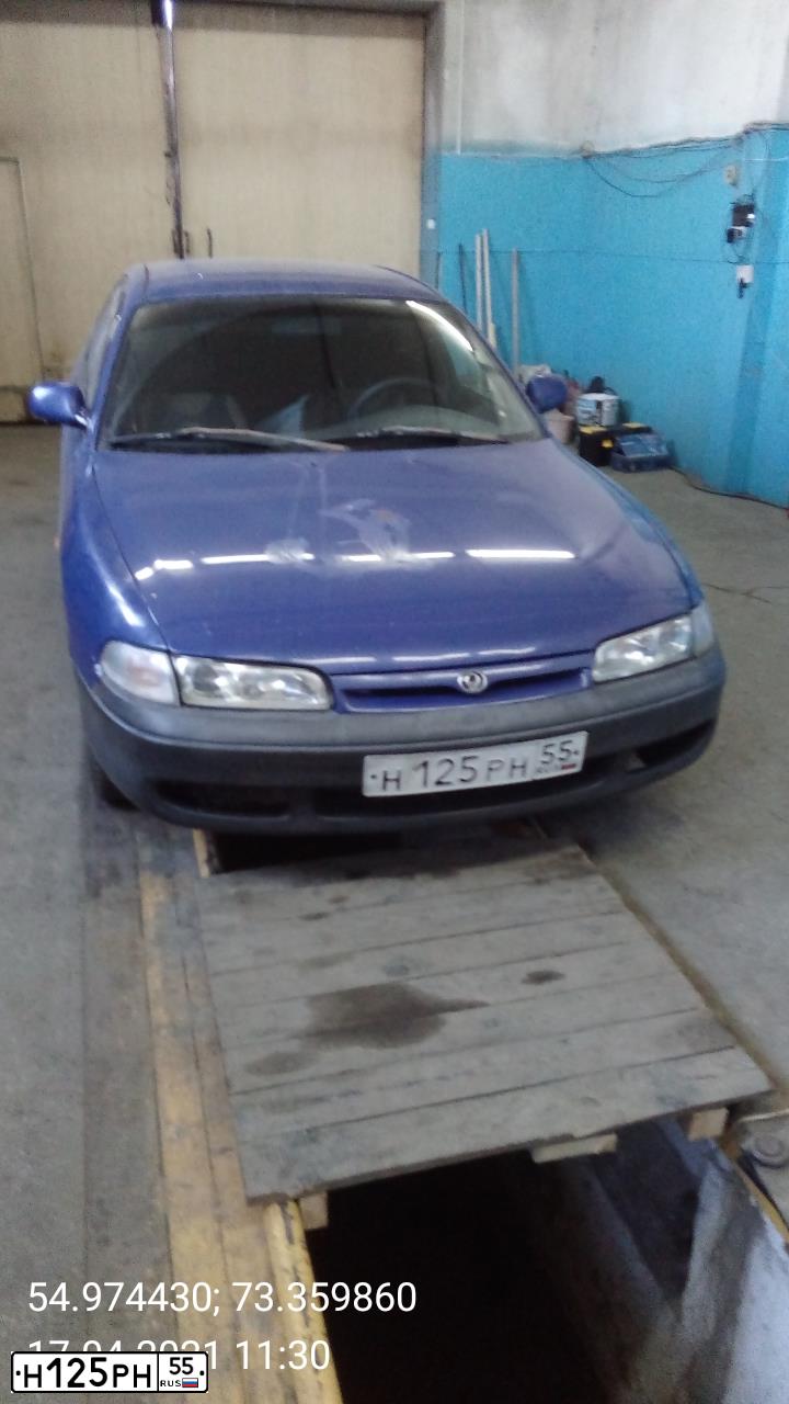 Фото автомобиля MAZDA 626, 1995 — госномер Н125РН55. Цвет: синий