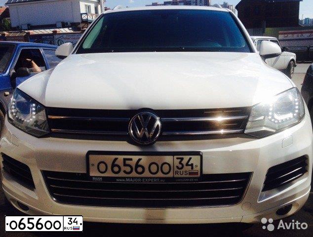 Фото автомобиля VOLKSWAGEN TOUAREG, 2012 — госномер С656ОО34. Цвет: Белый