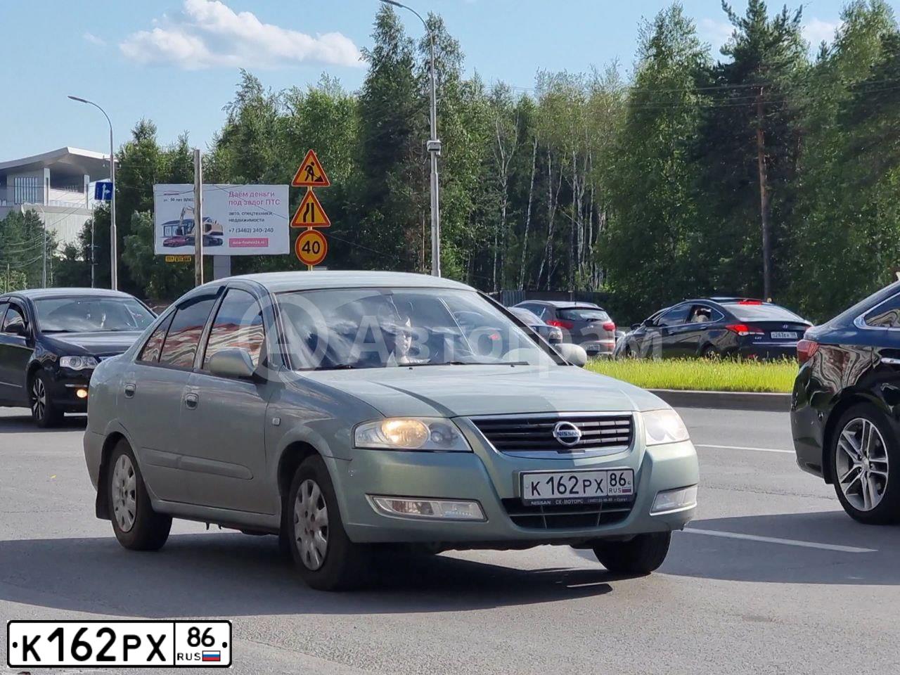 Фото автомобиля NISSAN ALMERA, 2007 — госномер К162РХ86. Цвет: СЕРО-ЗЕЛЕНЫЙ