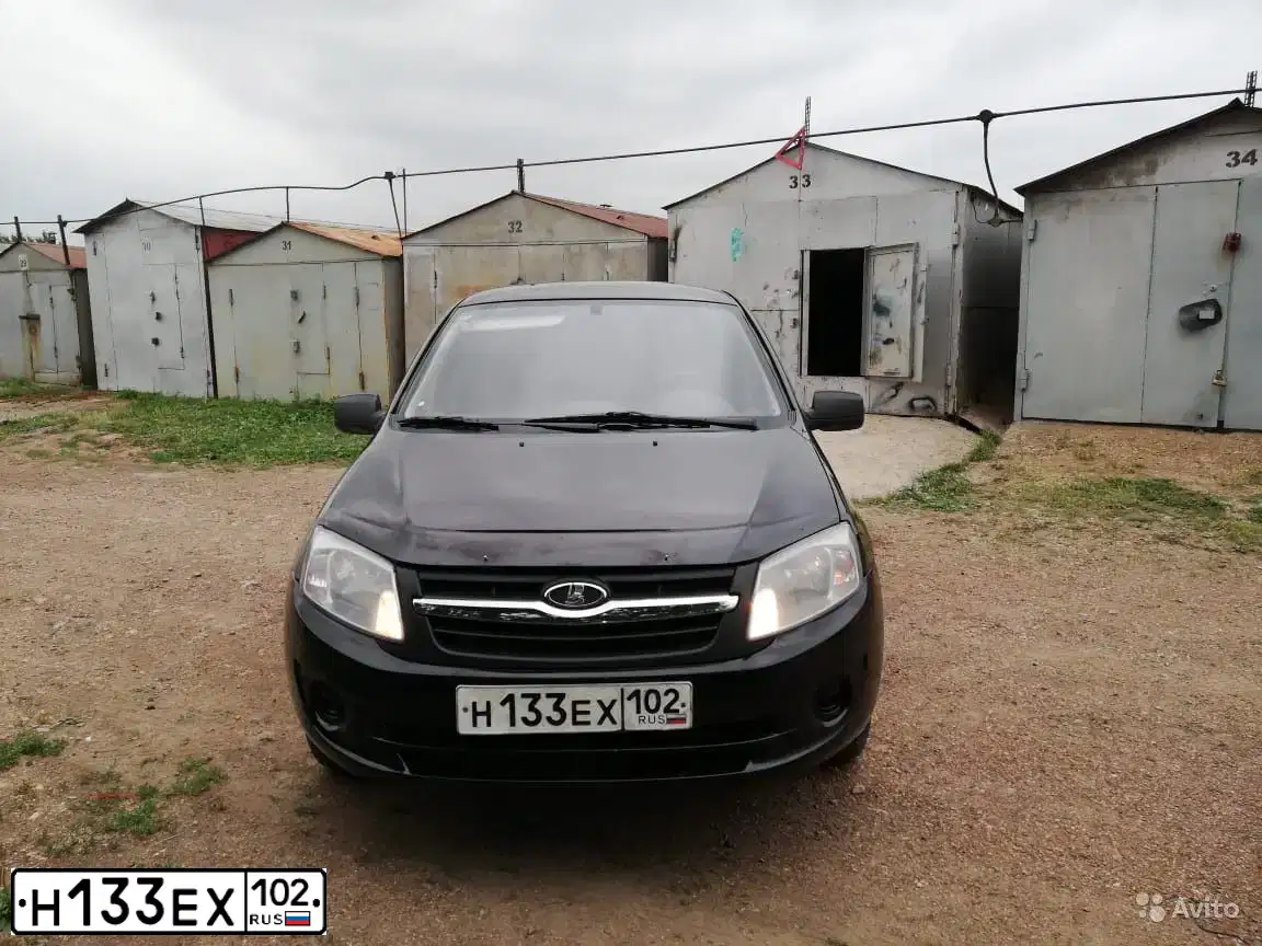 Фото автомобиля LADA 2190 GRANTA, 2012 — госномер Н133ЕХ102. Цвет: Сине-Черный