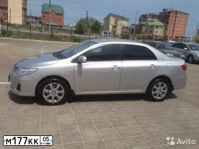 Фото автомобиля TOYOTA COROLLA, 2011 — госномер М177КК05. Цвет: Серебристый