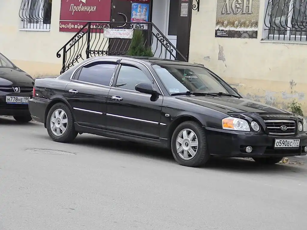 Фото автомобиля KIA MAGENTIS / OPTIMA, 2004 — госномер Р697ТО797. Цвет: ЧЕРНЫЙ