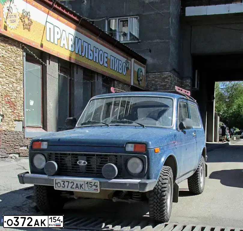 Фото автомобиля LADA 2121 NIVA, 2011 — госномер О372АК154. Цвет: СИНЕ-ЗЕЛЕНЫЙ