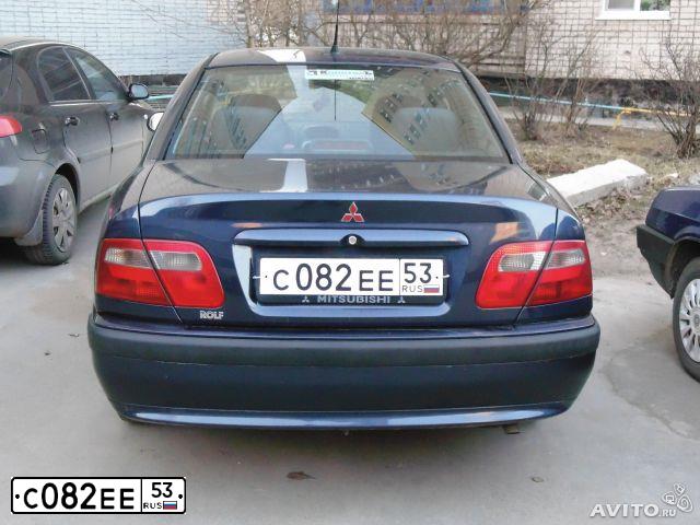 Фото автомобиля MITSUBISHI CARISMA, 2002 — госномер С082ЕЕ53. Цвет: ТЕМНО-СИНИЙ
