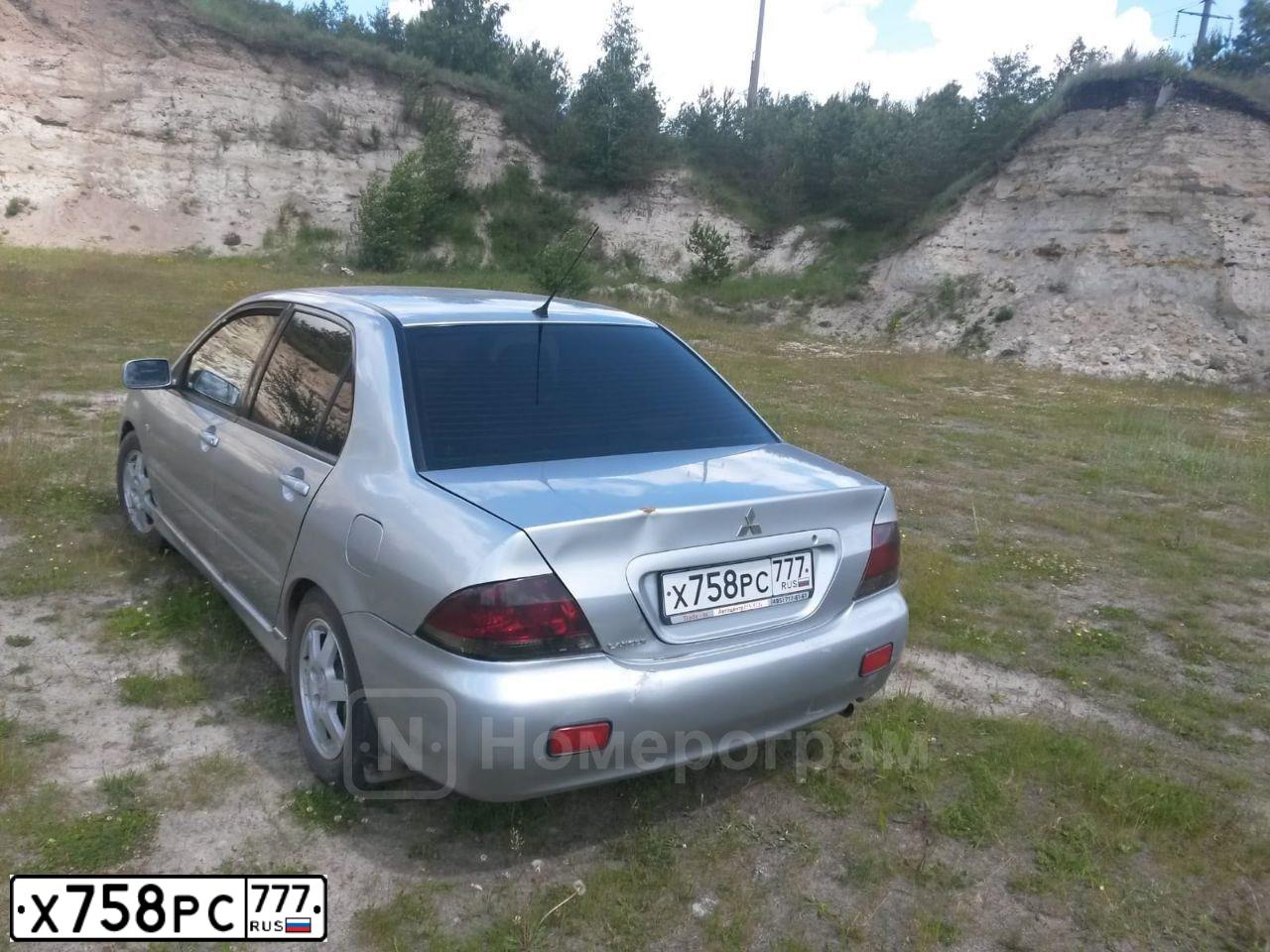 Фото автомобиля MITSUBISHI LANCER, 2004 — госномер Х758РС777. Цвет: СЕРЫЙ