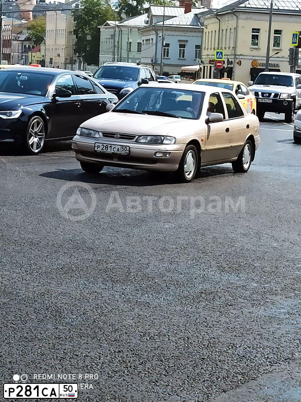 Фото автомобиля KIA SEPHIA, 1998 — госномер Р281СА50. Цвет: БЕЖЕВЫЙ