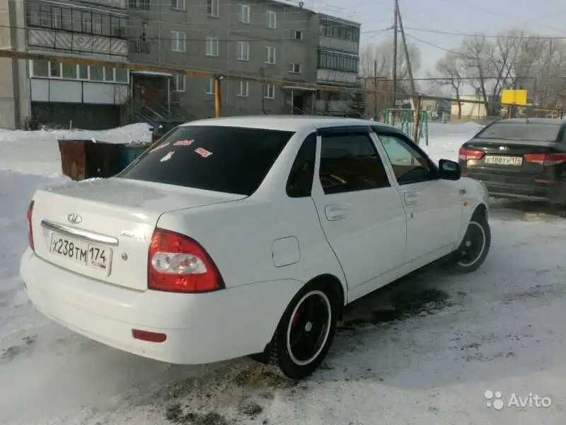 Фото автомобиля LADA 2190 GRANTA, 2019 — госномер Е151КЕ08. Цвет: серебристо темно серый