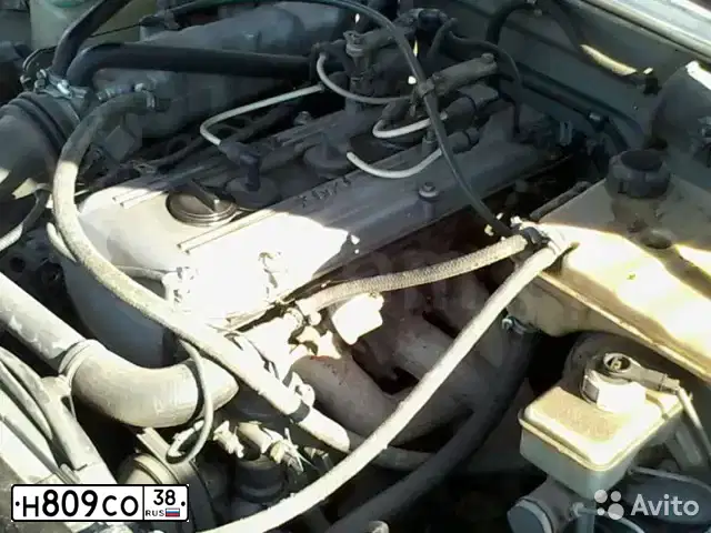 Фото автомобиля GAZ 3110 WOLGA, 2006 — госномер Н809СО38. Цвет: Серебристый