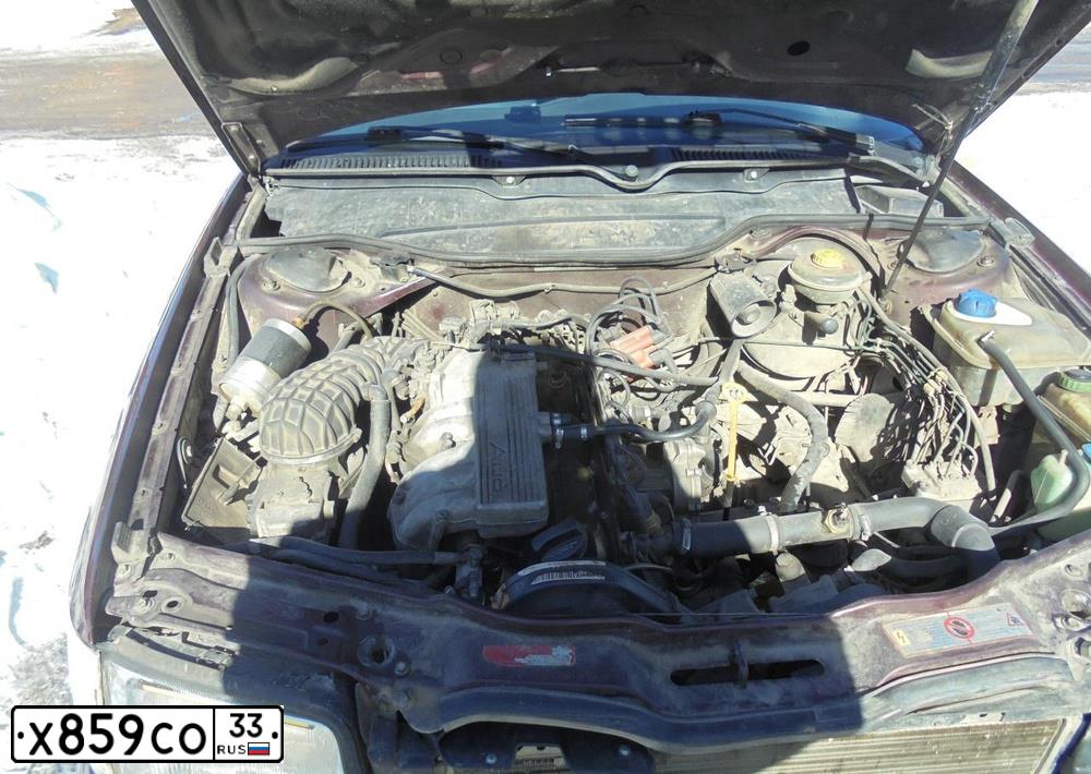 Фото автомобиля AUDI 100, 1993 — госномер О585СА33. Цвет: Красный