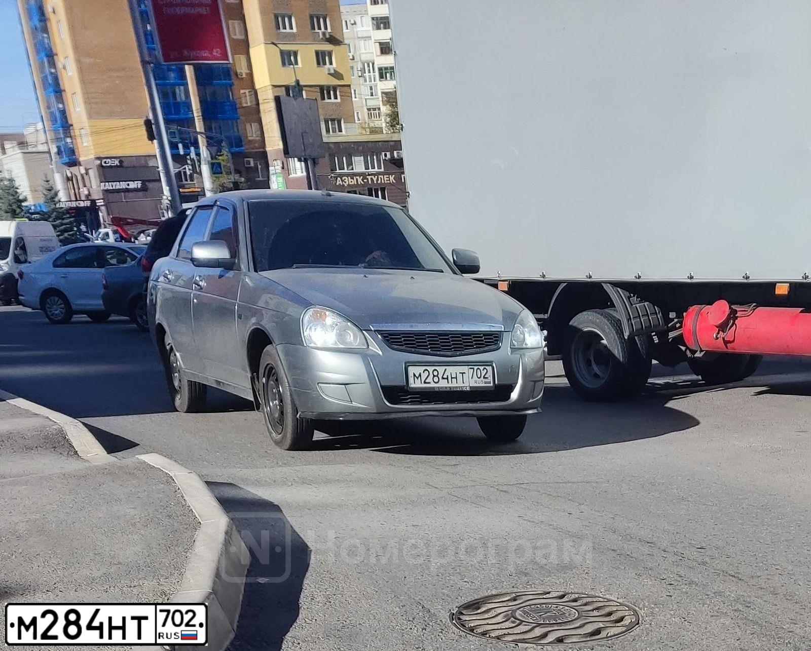 Фото автомобиля LADA 2170 PRIORA, 2012 — госномер М284НТ702. Цвет: СРЕДНИЙ СЕРО-ЗЕЛЕНЫЙ МЕТ