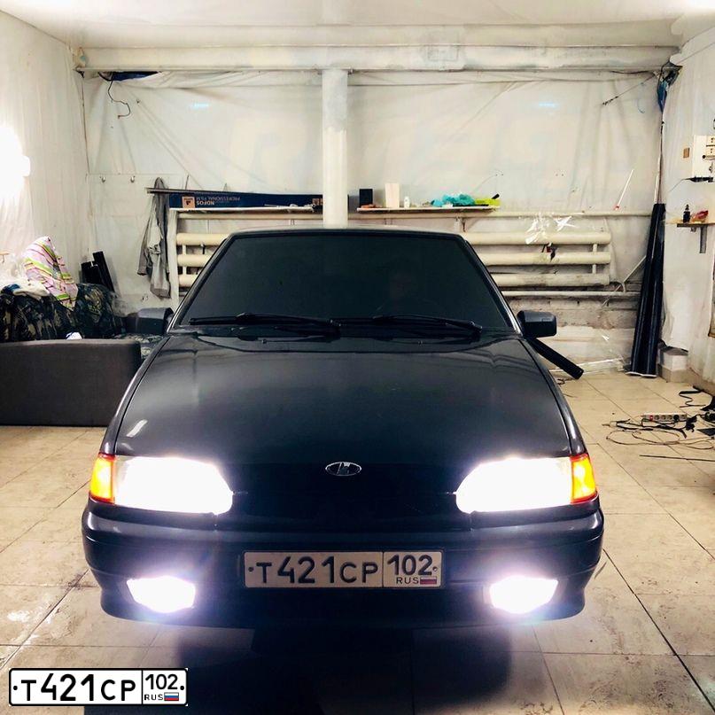 Фото автомобиля LADA 2114 SAMARA, 2011 — госномер Е987ВН774. Цвет: Сине-Черный