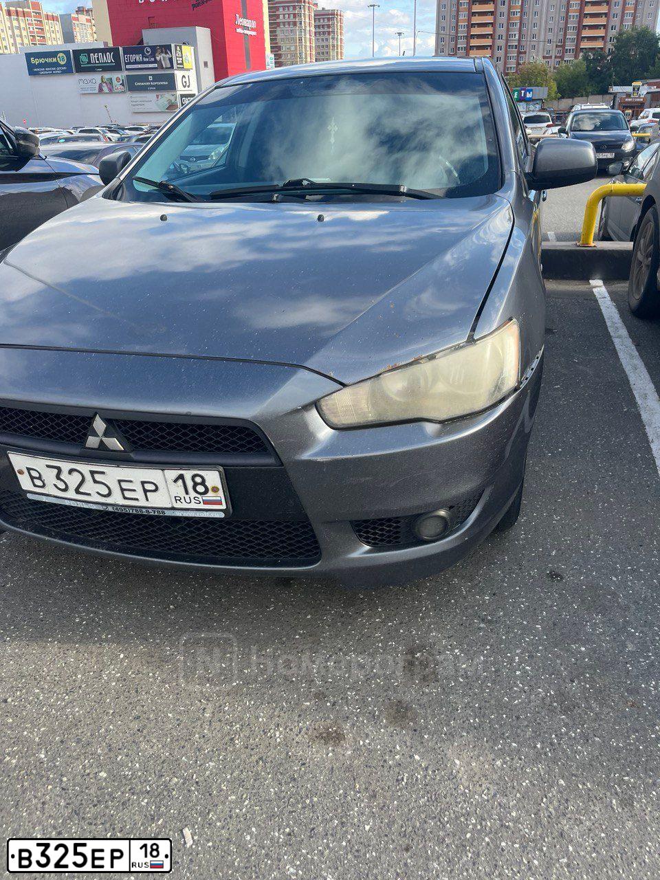 Фото автомобиля MITSUBISHI LANCER, 2007 — госномер В325ЕР18. Цвет: СЕРЫЙ