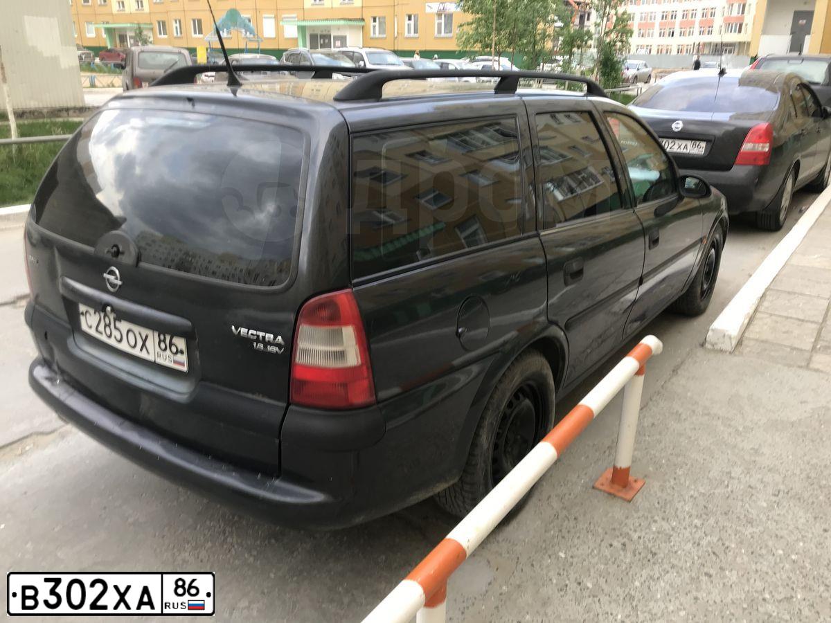Фото автомобиля NISSAN PRIMERA, 2005 — госномер В302ХА86. Цвет: ЧЕРНЫЙ