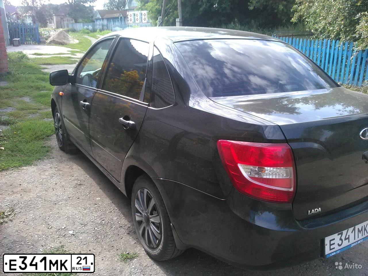 Фото автомобиля LADA 2190 GRANTA, 2014 — госномер Е341МК21. Цвет: Сине-Черный