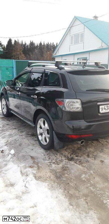 Фото автомобиля MAZDA CX-7, 2011 — госномер Е100АН13. Цвет: ЧЕРНЫЙ