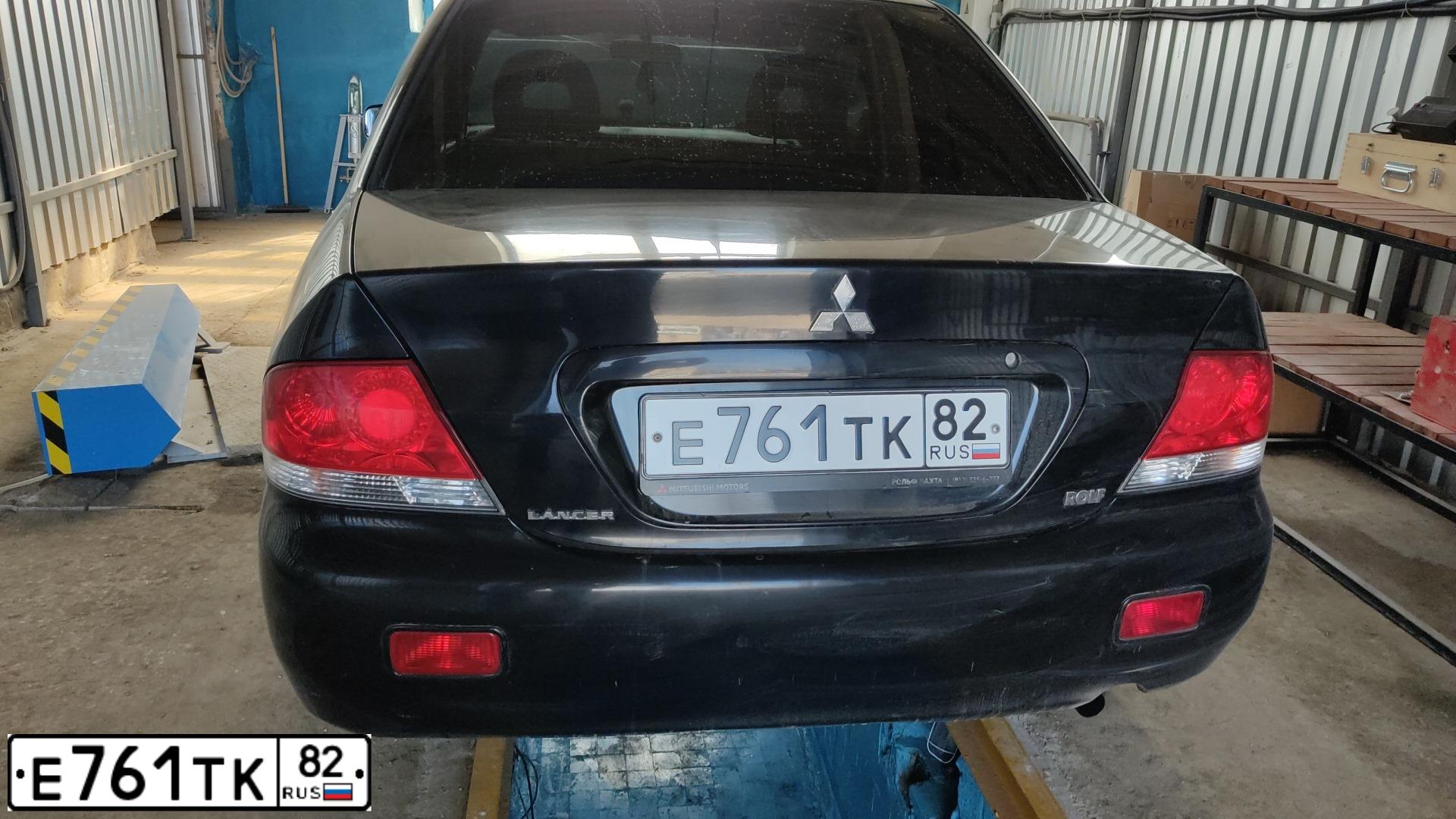 Фото автомобиля MITSUBISHI LANCER, 2004 — госномер Е761ТК82. Цвет: ЧЕРНЫЙ