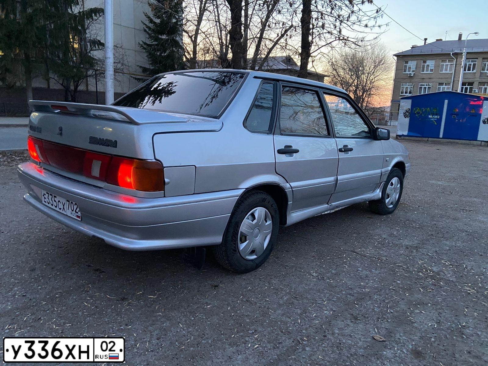 Фото автомобиля LADA 2115, 2004 — госномер Е335СХ702. Цвет: СЕРЕБРИСТЫЙ