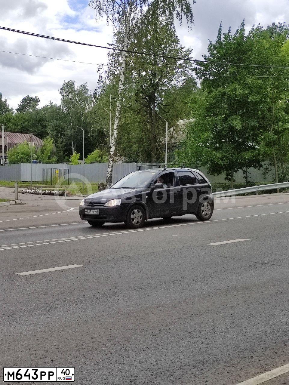 Фото автомобиля OPEL CORSA, 2002 — госномер Е522АР550. Цвет: ЧЕРНЫЙ