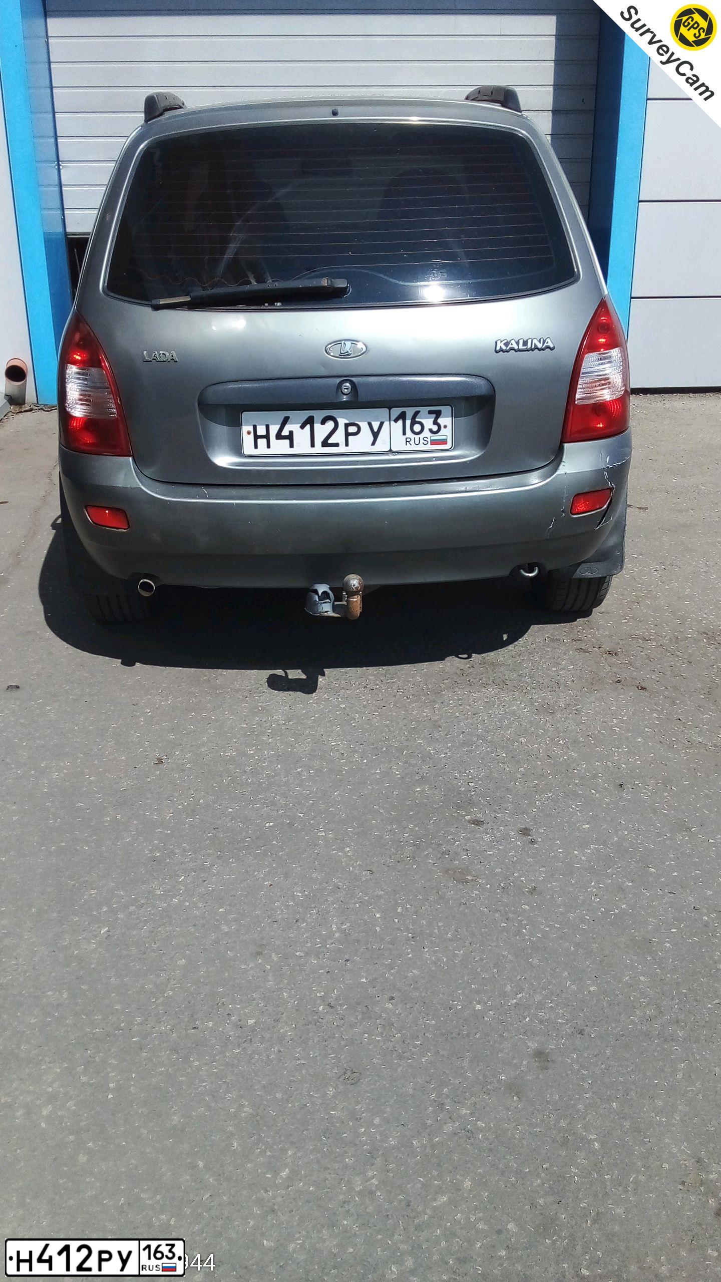 Фото автомобиля LADA KALINA, 2010 — госномер Н642АТ763. Цвет: серебристо-темно-серый