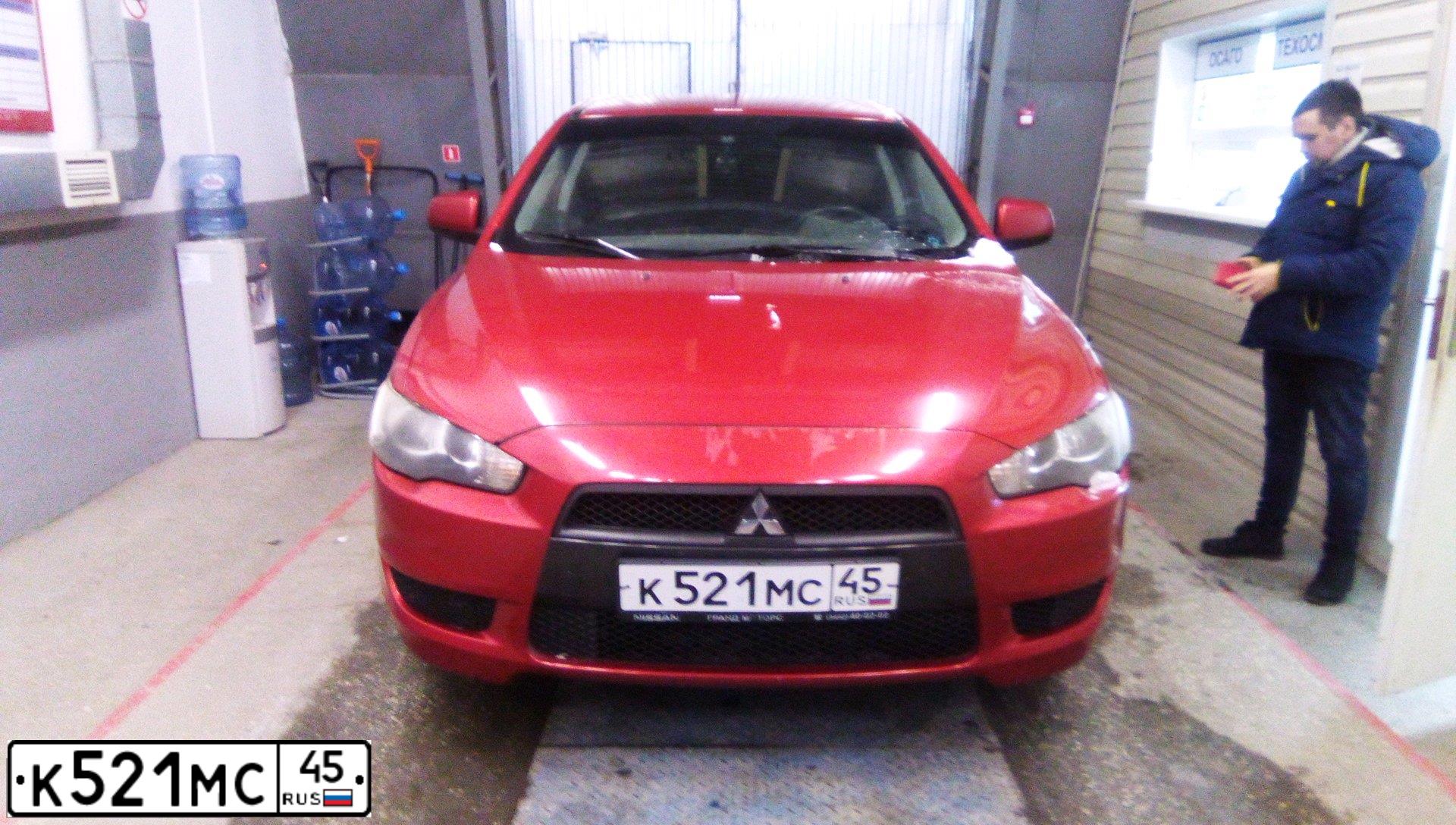 Фото автомобиля MITSUBISHI LANCER, 2007 — госномер К521МС45. Цвет: Красный