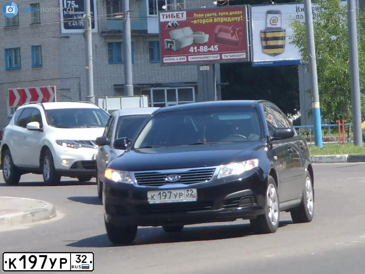 Фото автомобиля KIA MAGENTIS/OPTIMA/MG, 2009 — госномер Р969ОР32. Цвет: ЧЕРНЫЙ